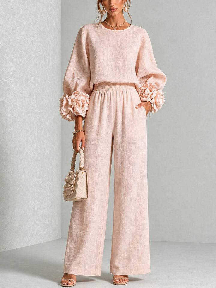 Pink Yolanda™ Ruffle Cuff Two-Piece Set by Bennett and Lowe, featuring ruffle details on the cuffs and a coordinated top and bottom.