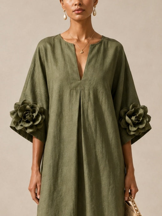 Juniper Bennett & Lowe flowy maxi dress with rose-cuff sleeves, lightweight fabric, and elegant design perfect for summer occasions.