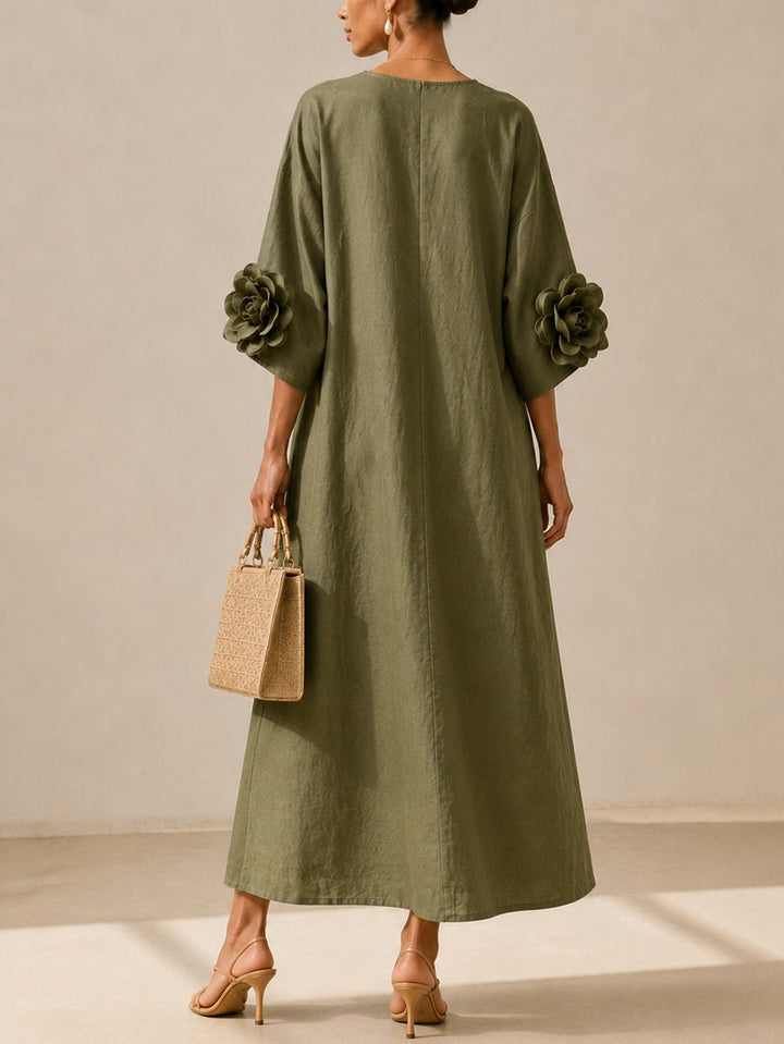 Juniper Bennett & Lowe flowy maxi dress with rose-cuff sleeves, soft fabric, and elegant silhouette in a stylish design.