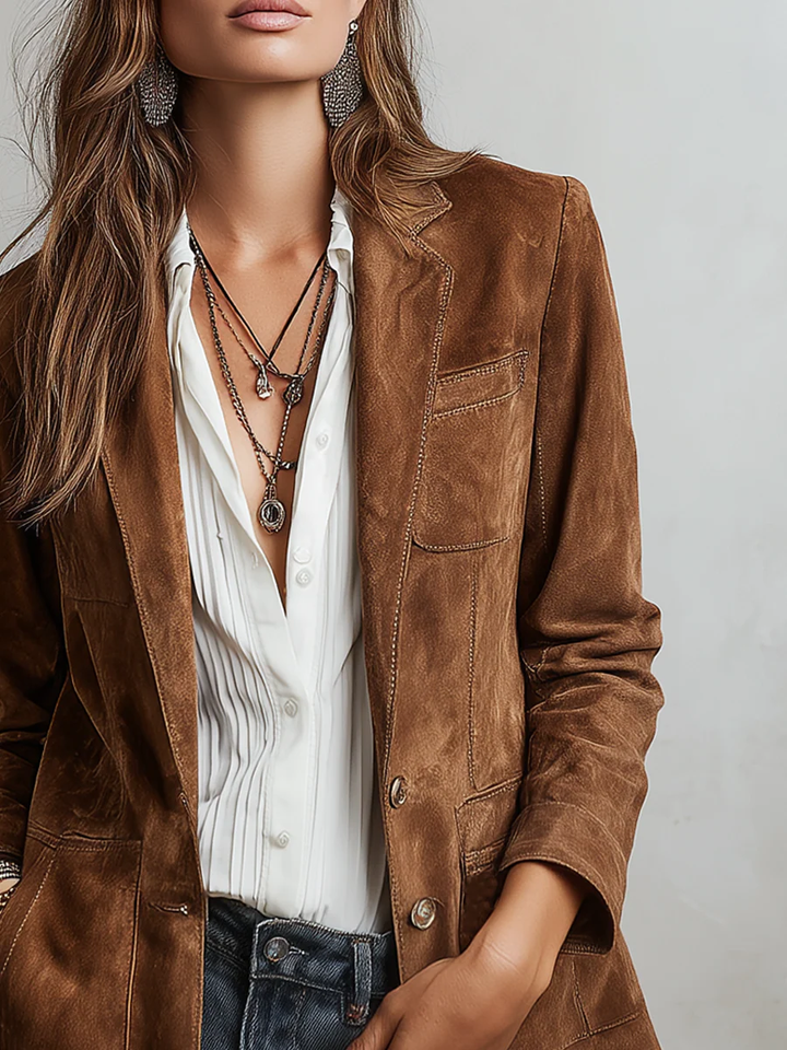 Brown tailored blazer for women with contrast stitching, from Bennett and Lowe's Verona collection, shown on a model.