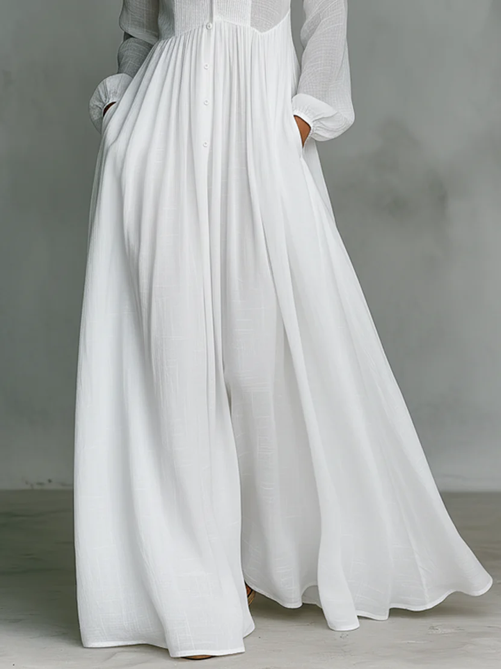 Léonie high-neck minimalist maxi dress for women in soft fabric, featuring a sleek silhouette and elegant design by Bennett and Lowe.