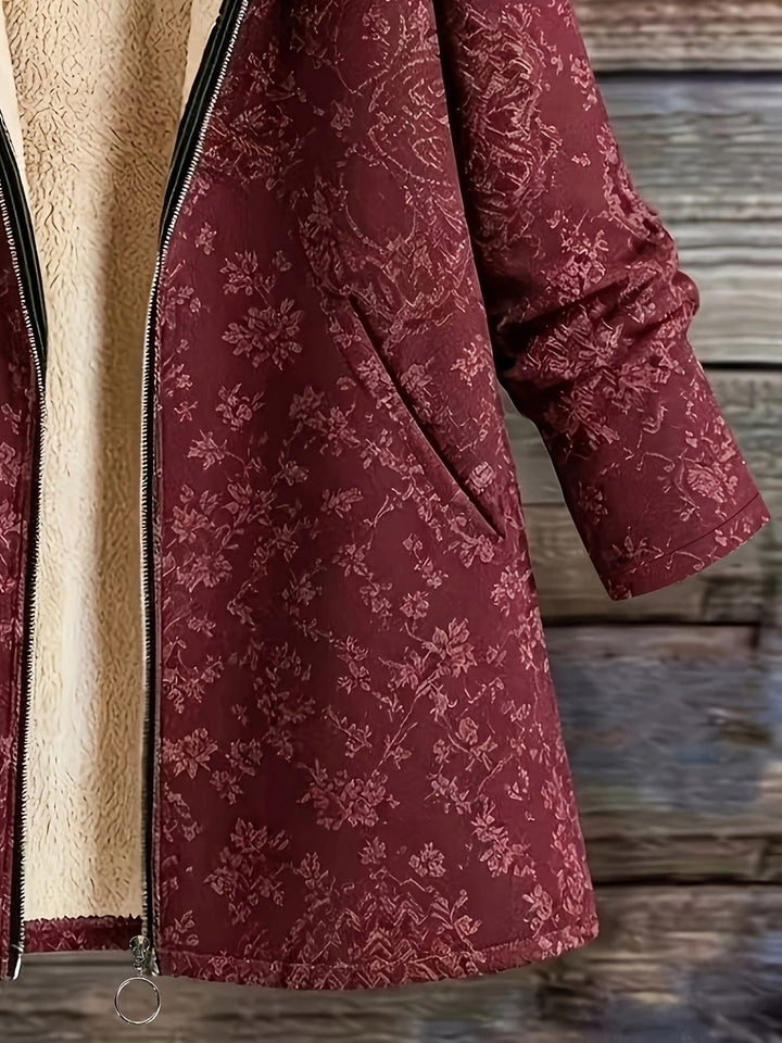 Eileen floral hooded longline coat by Bennett & Lowe, featuring a floral print, hood, and extended length for stylish warmth.