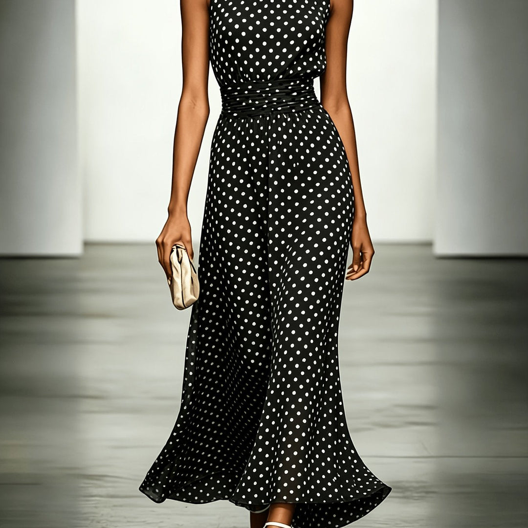 Polka dot maxi dress from Bennett and Lowe, featuring a flowy silhouette and vibrant dot pattern, worn by a model.