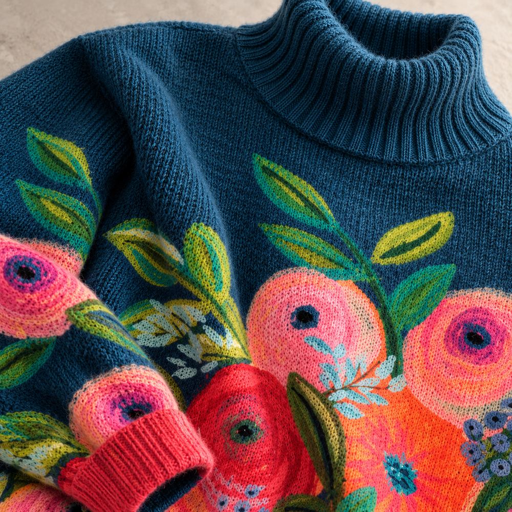 Floral embroidered Alice turtleneck knit sweater by Bennett and Lowe, showing textured fabric and colorful embroidery details.
