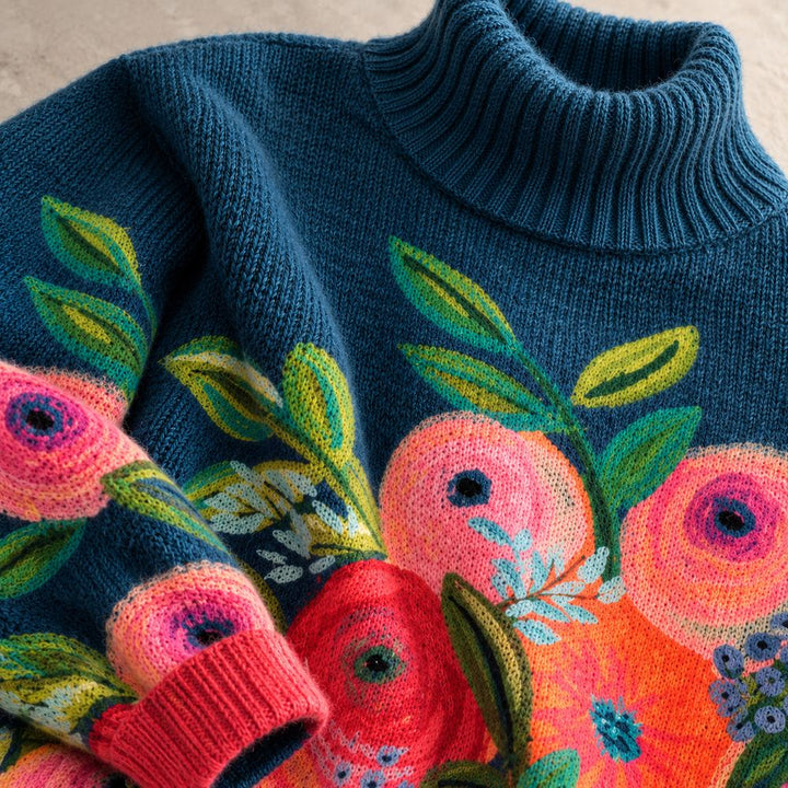 Floral embroidered Alice turtleneck knit sweater by Bennett and Lowe, showing textured fabric and colorful embroidery details.