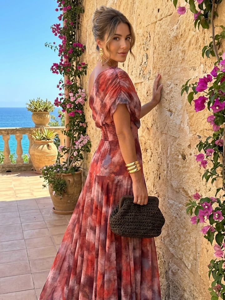 Valentina watercolor off-shoulder maxi dress for women by Bennett and Lowe, featuring flowing fabric and vibrant floral watercolor print.