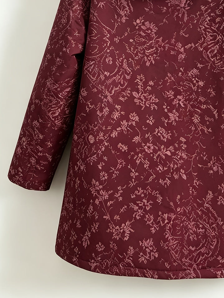 Eileen floral hooded longline coat by Bennett & Lowe, shown in a stylish floral print with a hood and extended length for warmth