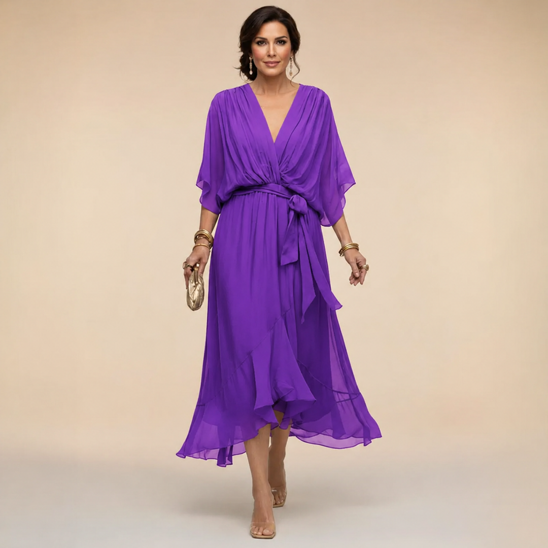 Clara Bennett and Lowe wrap V-neck dress in soft fabric, featuring a flattering waist tie and elegant V-neckline.
