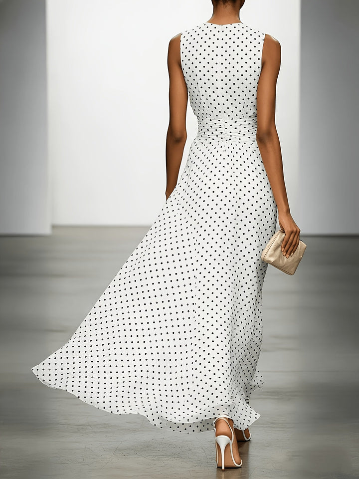 Polka dot maxi dress by Bennett and Lowe, featuring a flowing silhouette and stylish design, shown on a model.