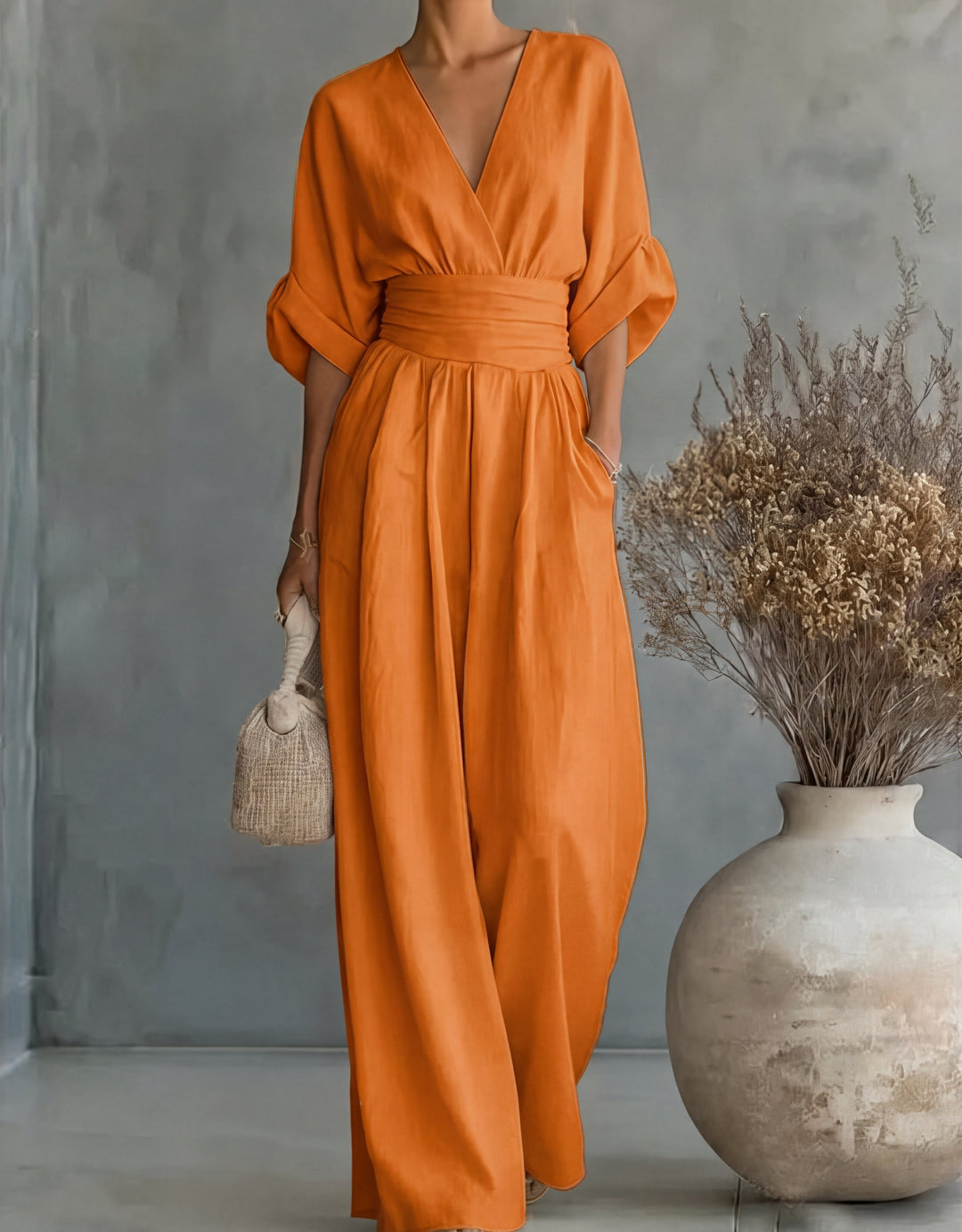 Bennett and Lowe Elise deep V-neck wide-leg jumpsuit for women, shown in a stylish, flowing design with long sleeves and a cinched waist.
