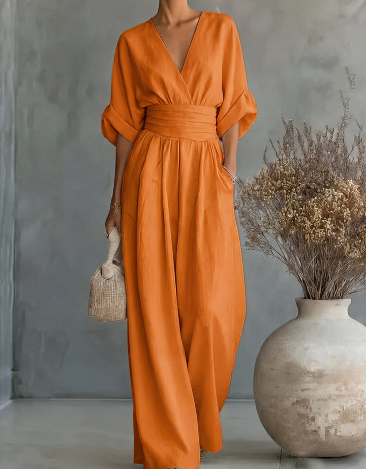 Bennett and Lowe Elise deep V-neck wide-leg jumpsuit for women, shown in a stylish, flowing design with long sleeves and a cinched waist.