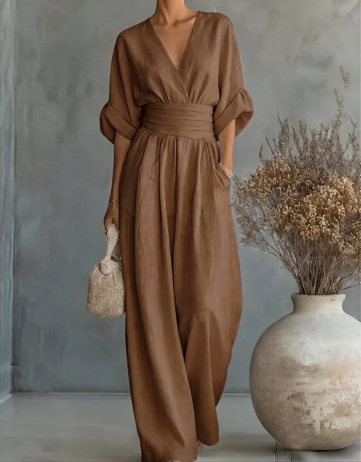Bennett and Lowe Elise deep V-neck wide-leg women's jumpsuit displayed on a hanger, showcasing its stylish design and elegant cut.