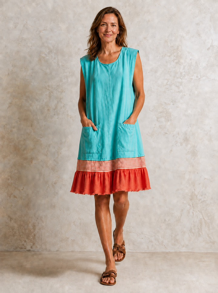 Hazel ruffle hem tunic dress by Bennett and Lowe, featuring a flowy silhouette and feminine ruffle details in soft fabric.
