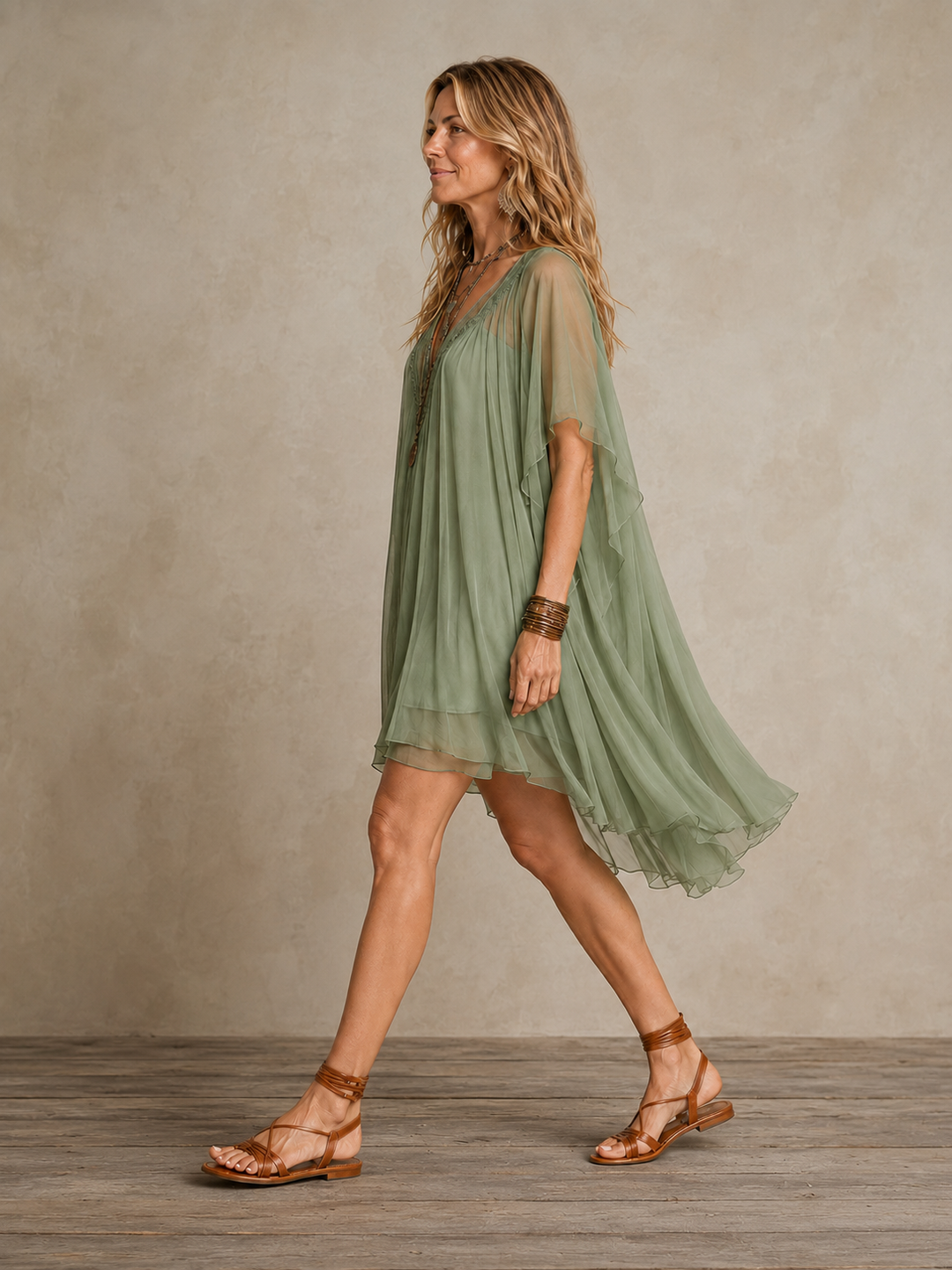 Olivia Newyork Ella tiered boho mini dress with flowing fabric and tiered design, perfect for casual and bohemian style.