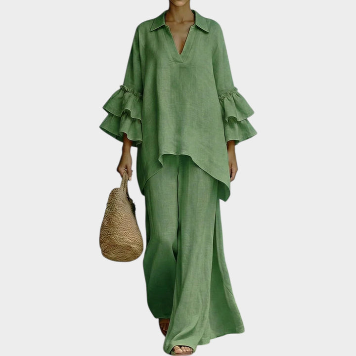 A woman wearing the Ariela oversized top and wide-leg pants two-piece set by Bennett and Lowe, showcasing relaxed fit and stylish design.