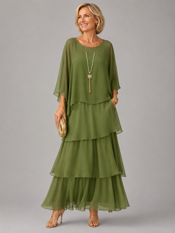 Elegant flowing maxi dress by Bennett and Lowe featuring a feminine silhouette and lightweight fabric in soft pastel colors.