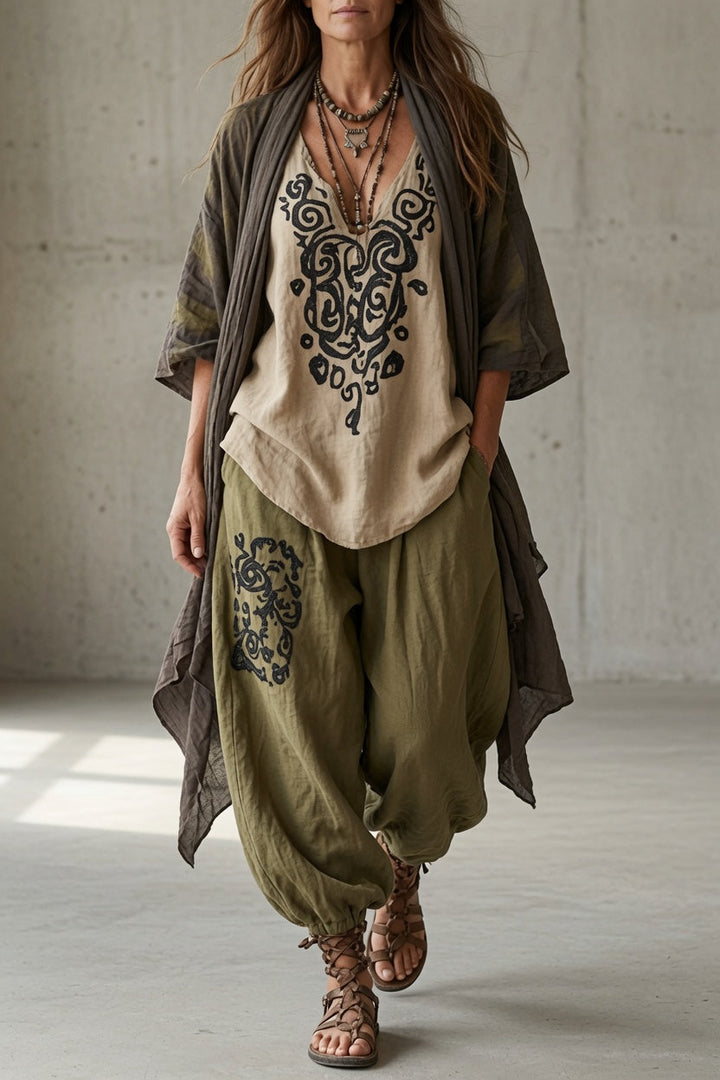 Joyce Bennett and Lowe draped three-piece set featuring coordinated fabric pieces and elegant design, shown on a mannequin.
