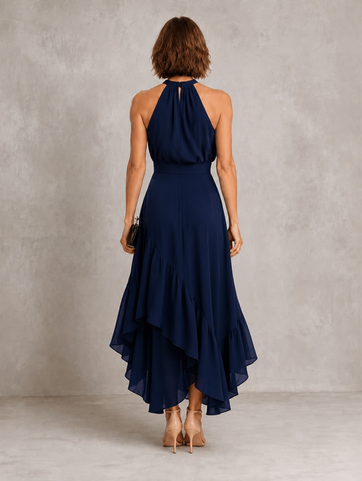 Chloe halter ruffle hem dress by Bennett and Lowe, featuring a flowing silhouette with ruffle details and halter neckline.