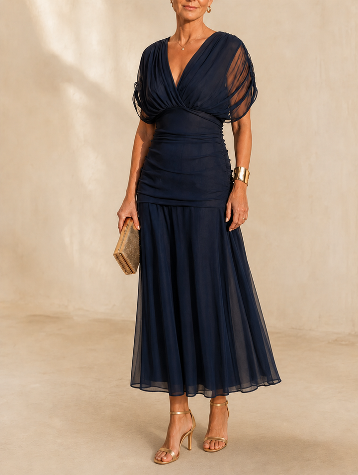 Seraphine Bennett and Lowe ruched flutter midi dress from the Signature Vestidos collection, featuring elegant design and flowing fabric.