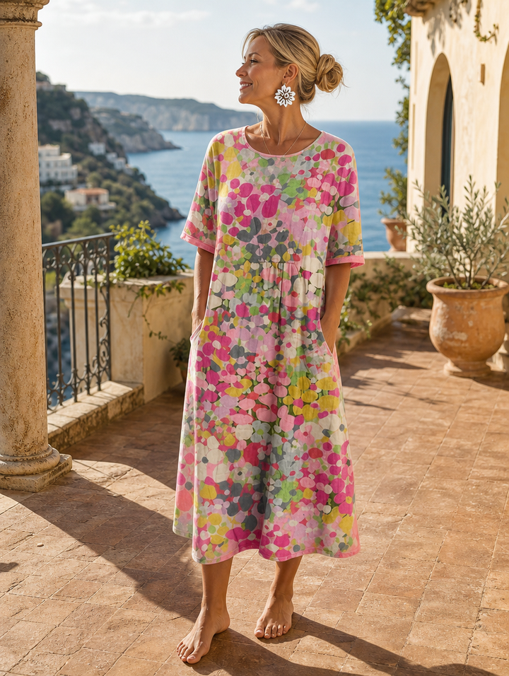 Elegant floral summer midi dress by Bennett and Lowe, featuring lightweight fabric and a feminine silhouette.