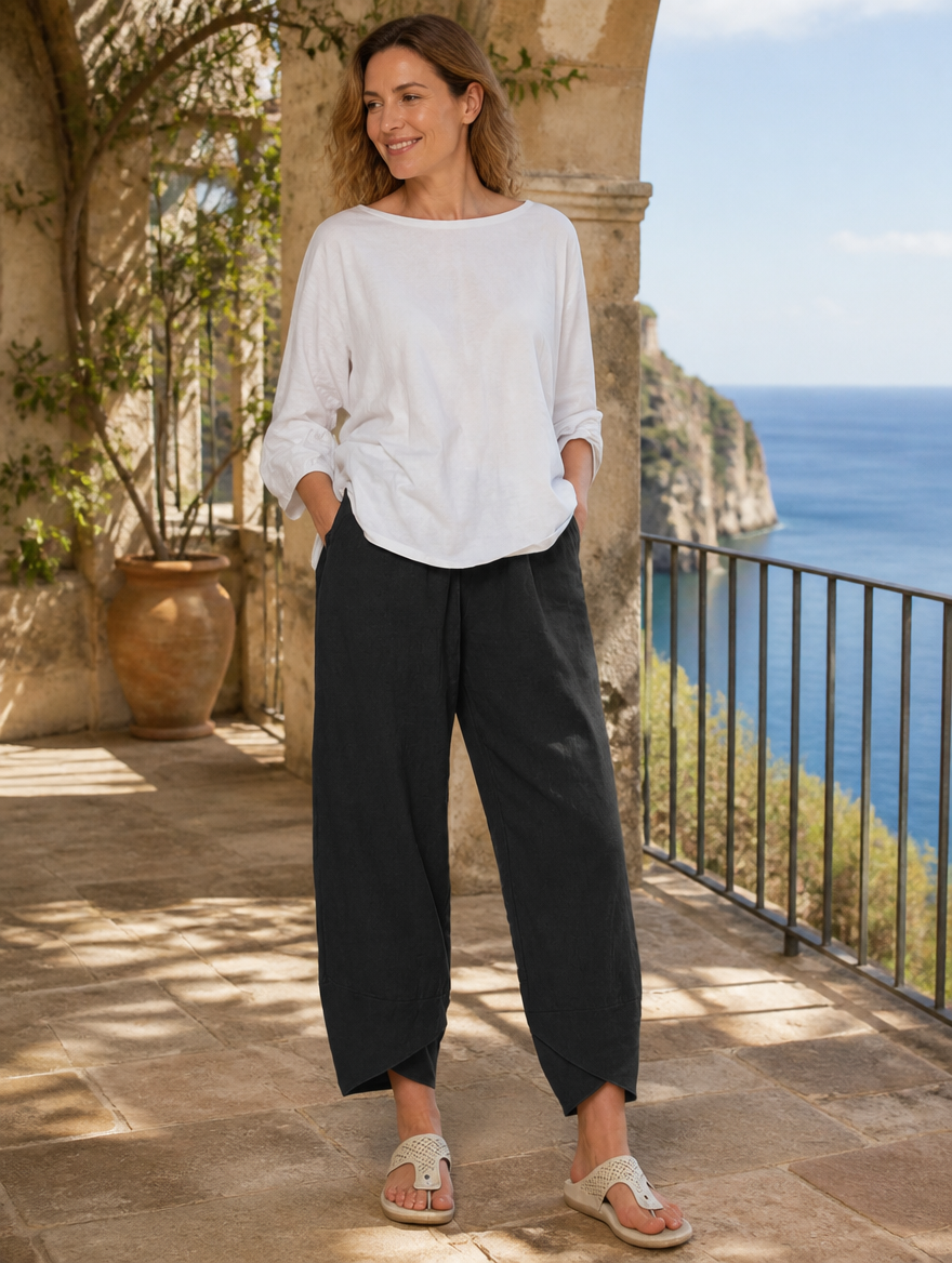 Bryndis Summer Wide Leg Pants in lightweight fabric, beige color, high waist design, displayed on a hanger against a neutral background.