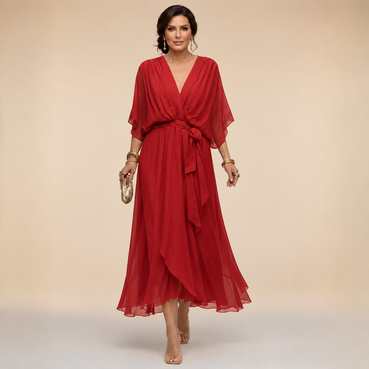 Bennett and Lowe Monica V-neck dress in a flowing fabric, featuring a fitted waist and elegant V-neckline.