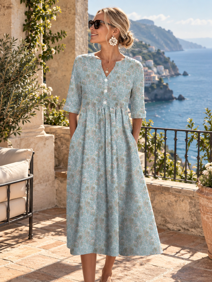 Floral summer midi dress for women by Bennett & Lowe, featuring a flowing design and vibrant floral pattern.