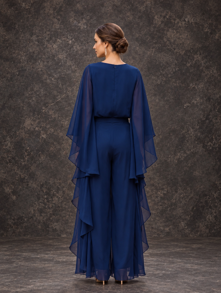 Gloria two-piece set by Bennett & Lowe featuring a cape-sleeve top and ruffle skirt, styled together for a fashionable look.