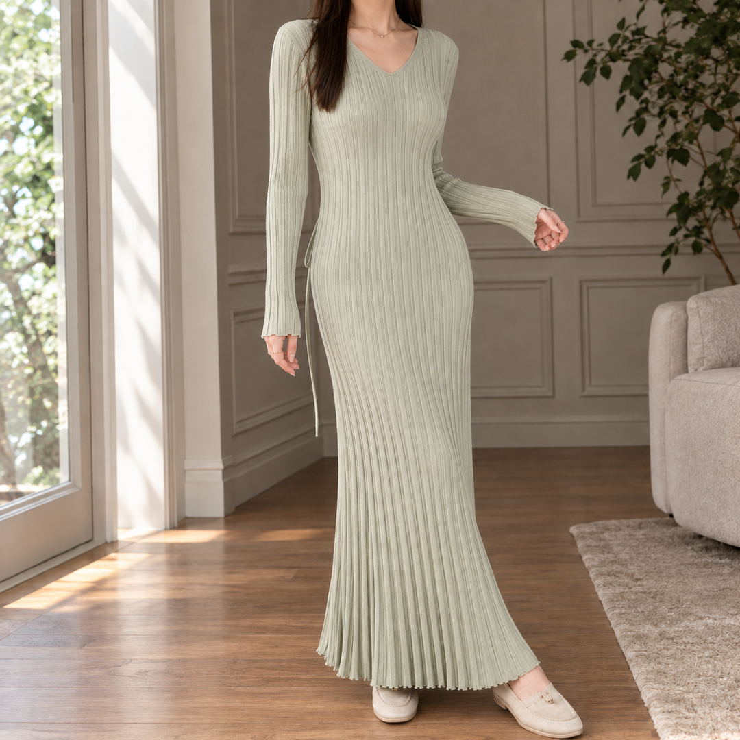 Bennett and Lowe Thea pleated V-neck mermaid maxi dress in elegant fabric, featuring a fitted bodice and flowing skirt.