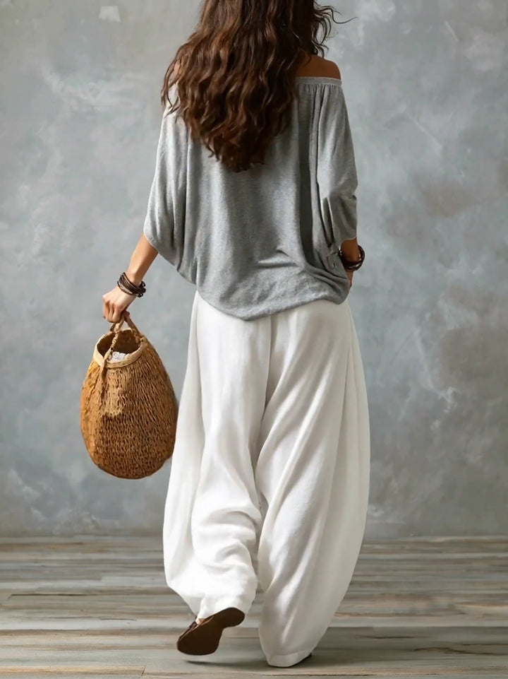 Leslie off-shoulder two-piece set by Bennett and Lowe, featuring a bohemian-inspired top and matching skirt with flowing fabric.
