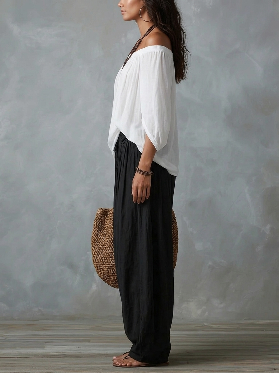 Leslie off-shoulder two-piece set by Bennett and Lowe, featuring a bohemian-inspired design with flowing fabric and layered details.