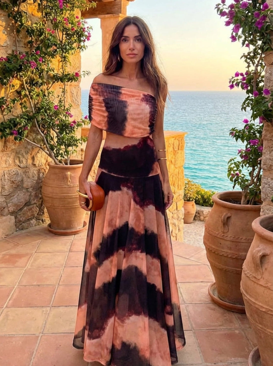 Bianca women's maxi dress by Bennett and Lowe with orange and brown floral print, flowing fabric, and sleeveless design.