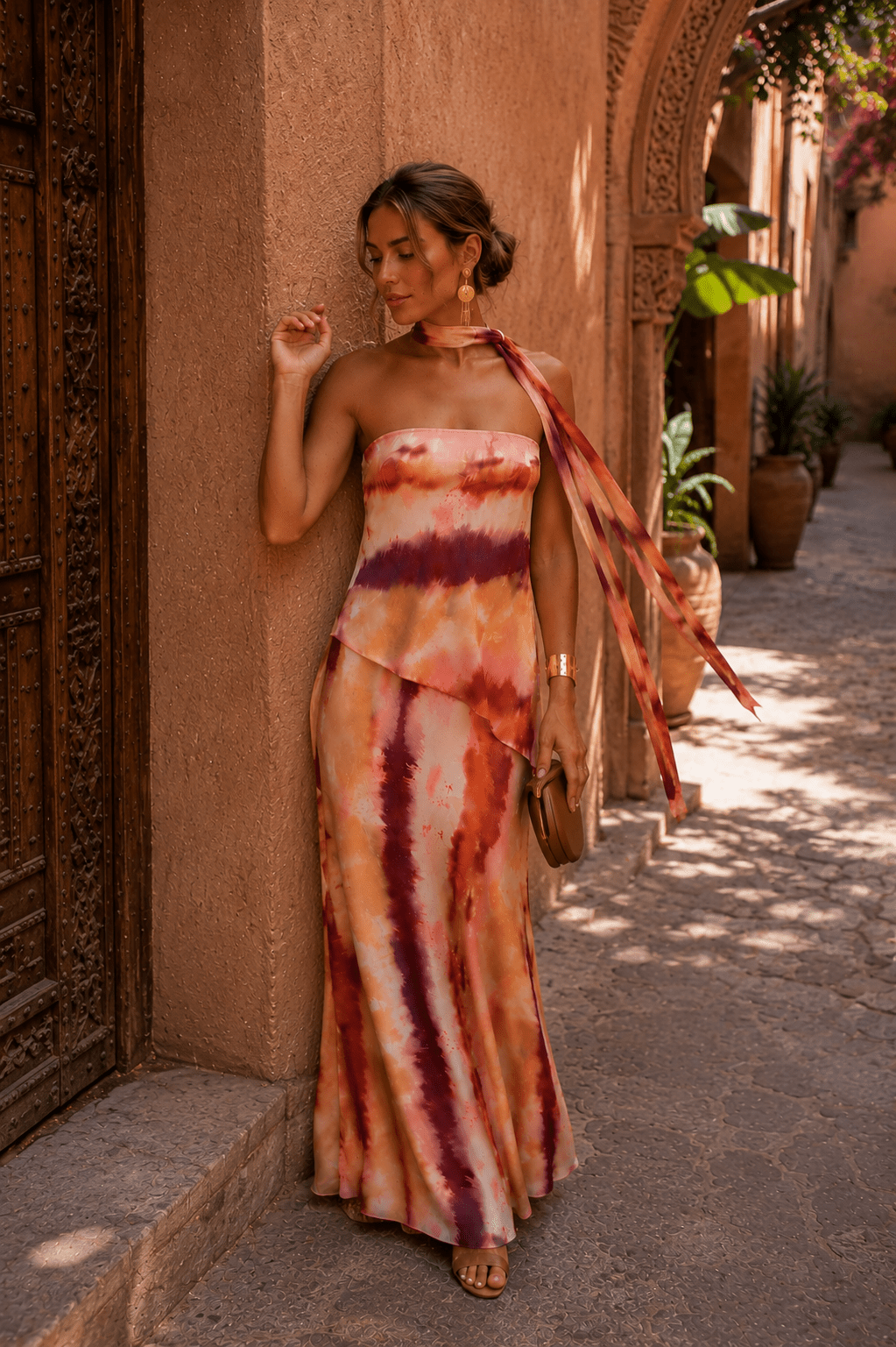 Printed strapless maxi dress for women by Bennett and Lowe, featuring a colorful, flowing design and strapless neckline.