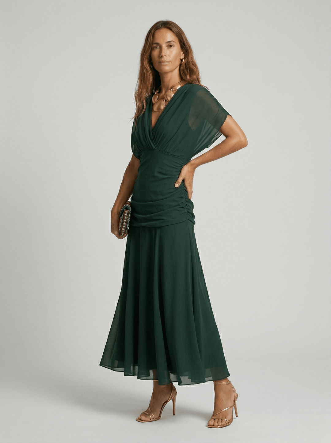 Long V-neck maxi dress for women by Bennett and Lowe, featuring a flowing silhouette and elegant design.