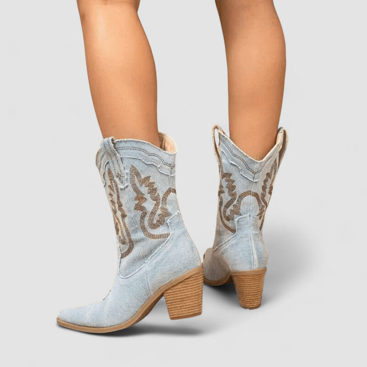 Light blue embroidered Western ankle boots for women by Bennett and Lowe, featuring detailed embroidery and a classic Western style.