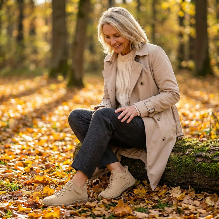 Rosie Bennett and Lowe women's supportive comfort sneakers in black with white soles, featuring a cushioned design and breathable material.