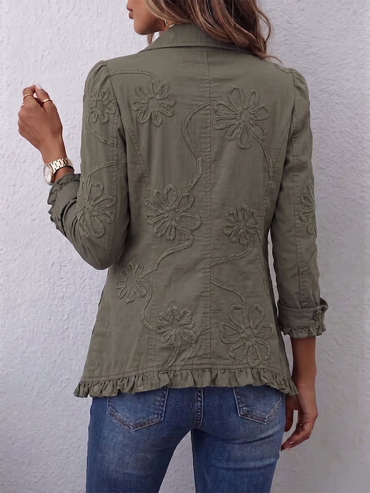Kamberly floral embroidered ruffle utility jacket for women by Bennett and Lowe, showing detailed floral embroidery and ruffle accents.