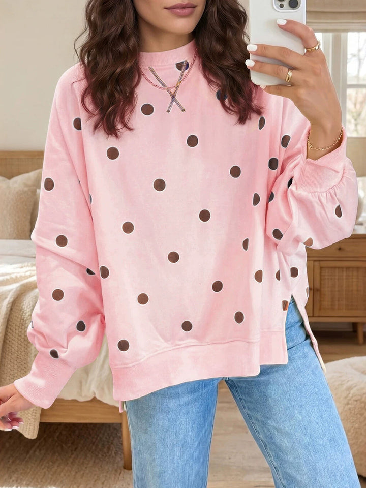 Bennett & Lowe Tessa polka dot relaxed sweatshirt with a loose fit and long sleeves, featuring a playful black and white polka dot pattern.