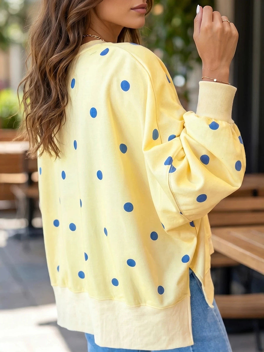 Bennett & Lowe Tessa polka dot relaxed sweatshirt with long sleeves and casual fit, featuring a black and white polka dot pattern.