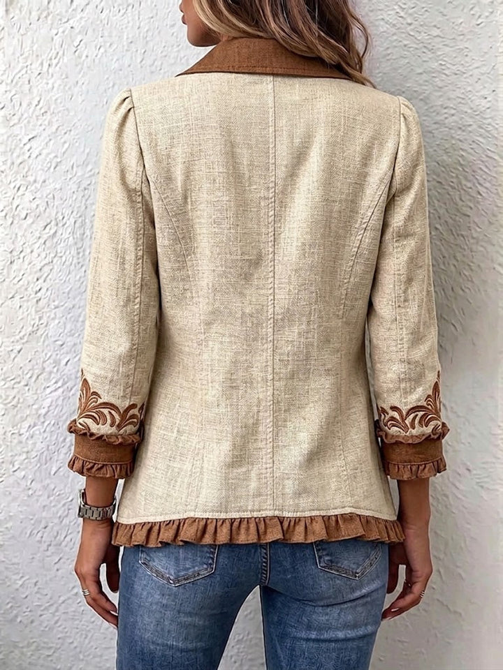 Vintage bohemian floral ruffled jacket for women by Bennett and Lowe, featuring colorful floral patterns and ruffled details.