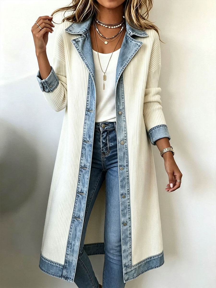 Maeve Bennett and Lowe contrast trim longline cardigan hanging on a wooden rack, showcasing its design and length.