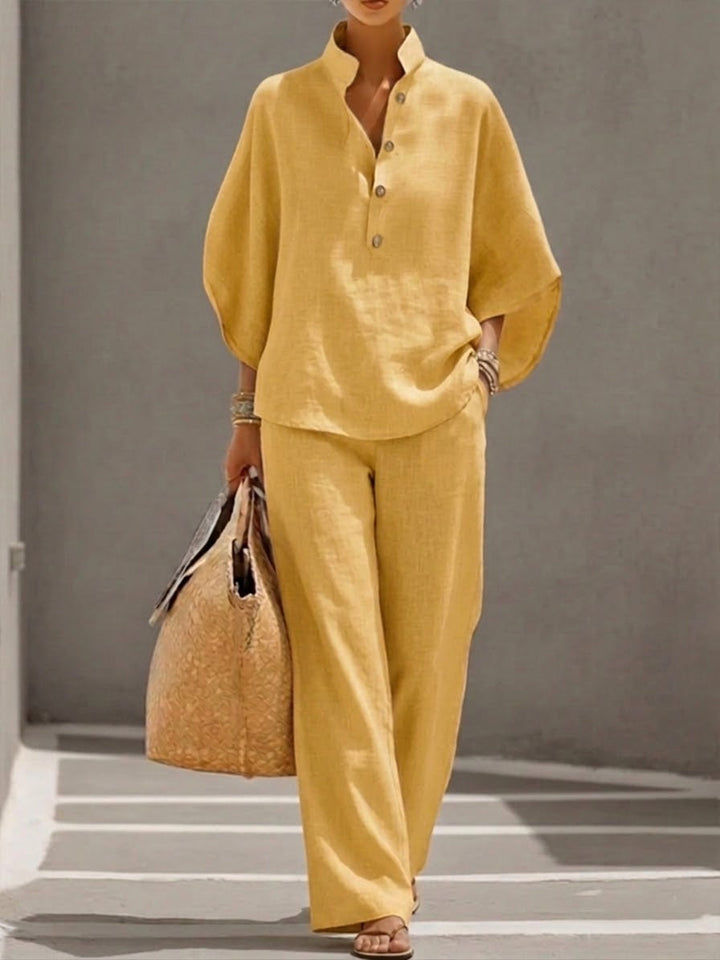 Harper two-piece women's set with batwing top and wide-leg pants by Bennett and Lowe, shown in a stylish indoor setting.