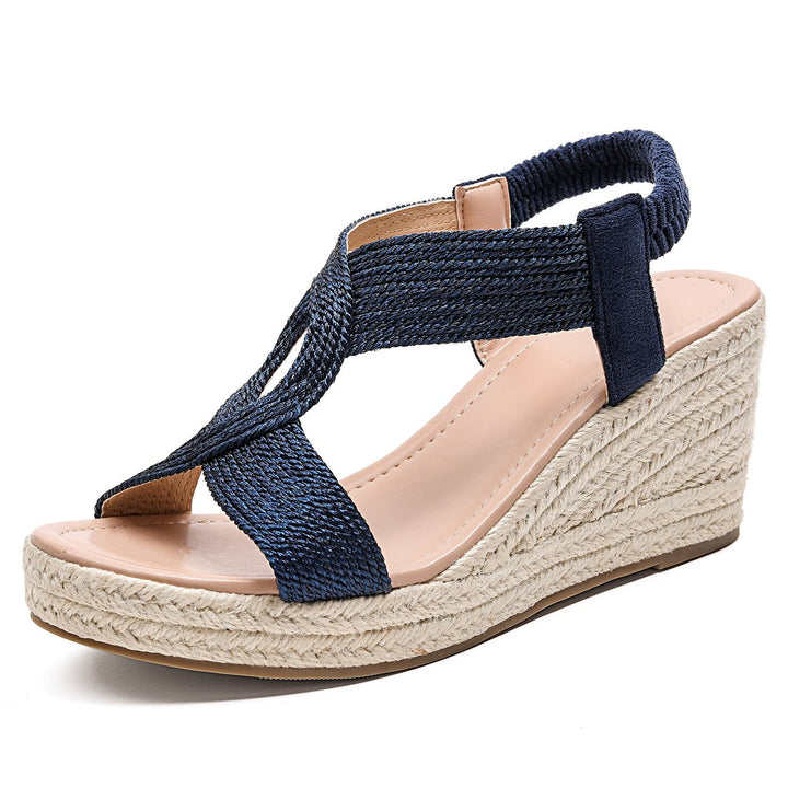 Handwoven Aroa wedge sandals by Bennett and Lowe featuring natural fiber straps and a wooden wedge heel.