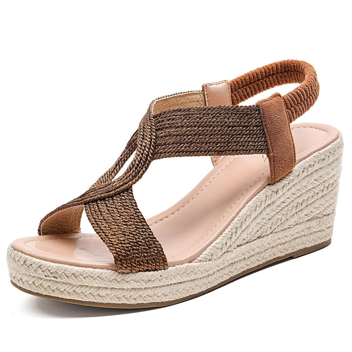 A pair of Bennett and Lowe Aroa handwoven wedge sandals with tan straps and woven jute wedge heel, displayed on a neutral background.