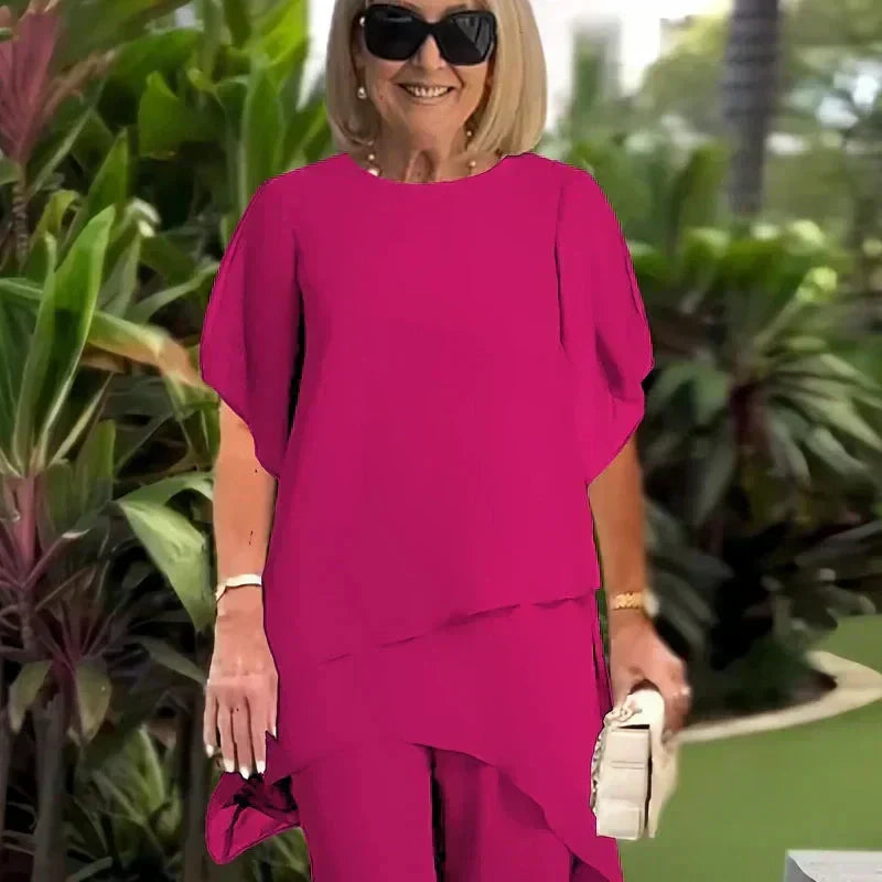 Patricia asymmetrical top and pants set by Bennett and Lowe, featuring a stylish, modern design with coordinated matching fabric.