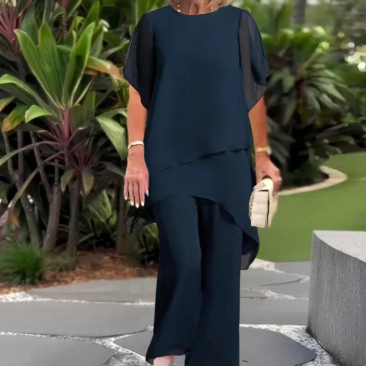 Patricia asymmetrical top and pants set by Bennett and Lowe, featuring a stylish, modern design with a coordinated fabric look.