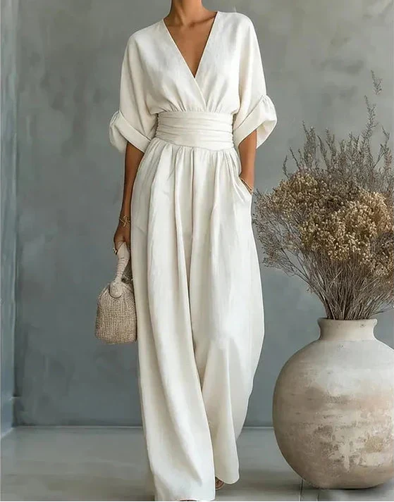 Women’s deep V-neck wide-leg jumpsuit by Bennett and Lowe, Elise style, shown in a stylish, flowy fabric.