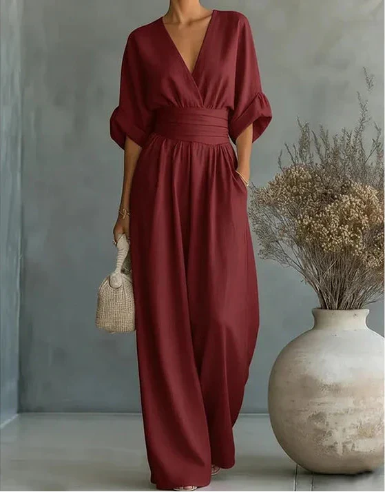 Women’s Elise Bennett and Lowe deep V-neck wide-leg jumpsuit, featuring flowing fabric and stylish design, shown on a model.