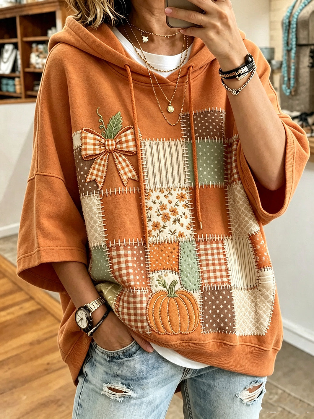 Larisa Bennett & Lowe oversized hoodie with autumn print, featuring warm fall colors and a relaxed fit for cozy style.