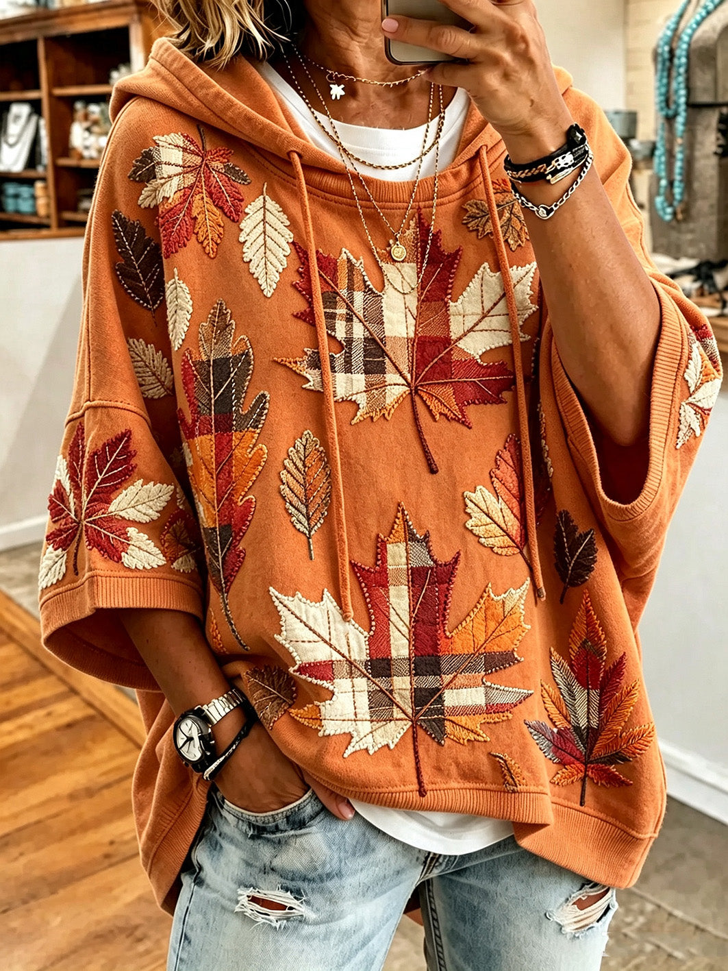 Bennett & Lowe Otilia oversized hoodie with autumn leaf print in warm fall colors, cozy and stylish for autumn wear.